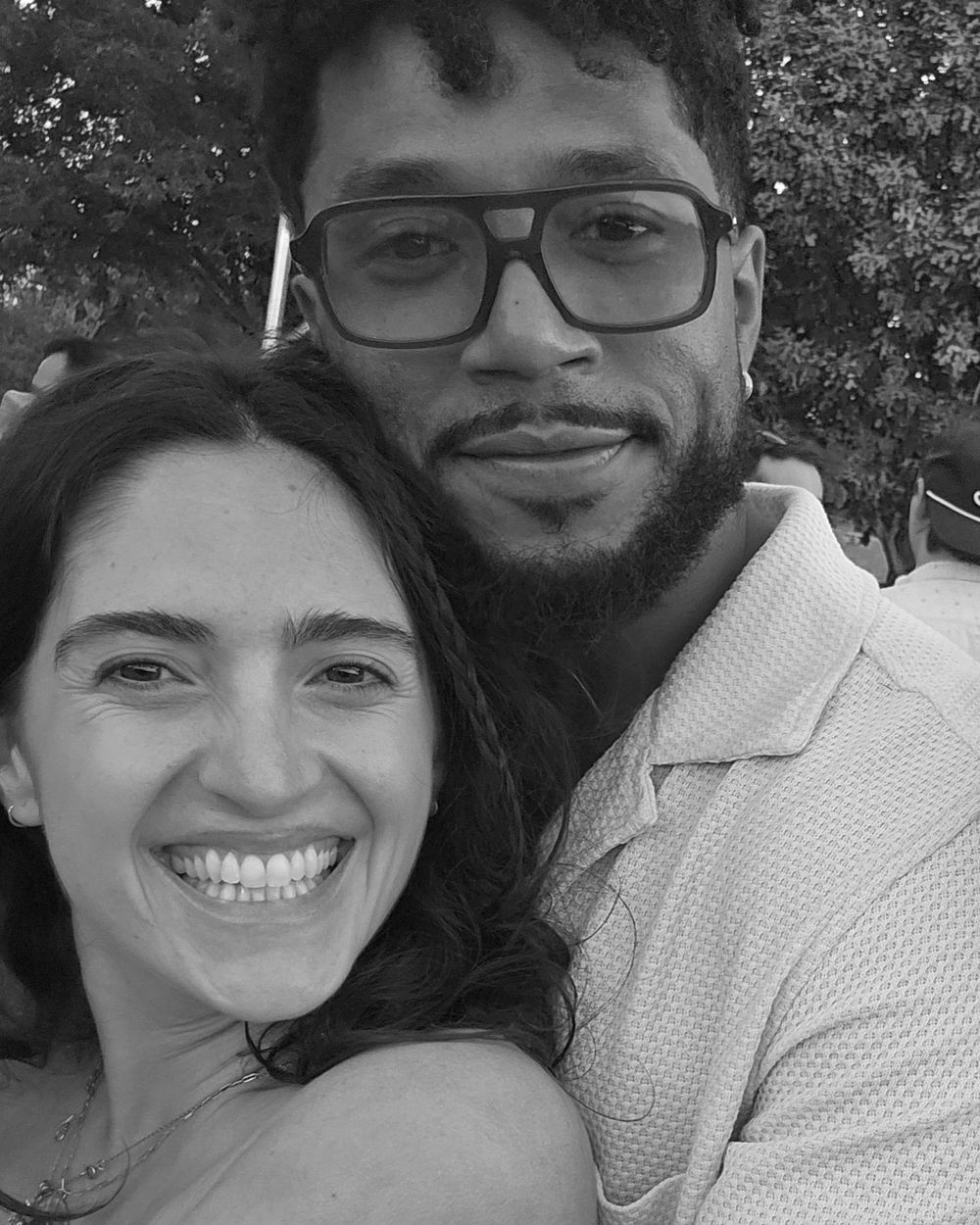 Samantha and her partner Los, cheek to cheek, both smiling